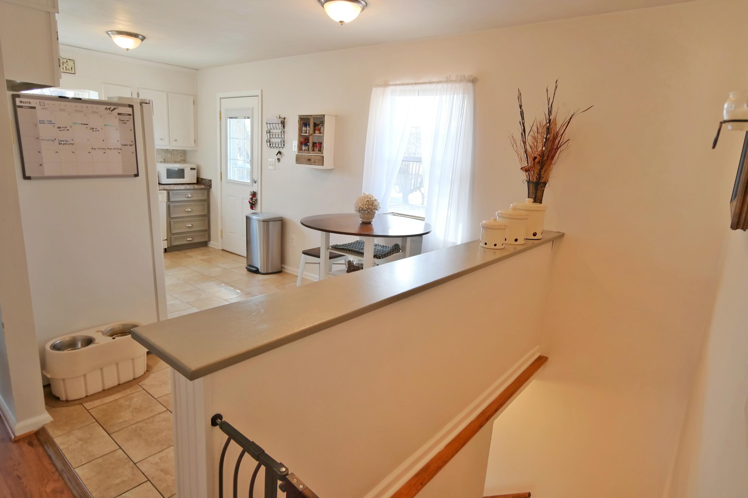 5726 Cove Road Roanoke, VA 24019 - Photo 10 of 34 a kitchen with stainless steel appliances granite countertop a refrigerator a sink and white cabinets