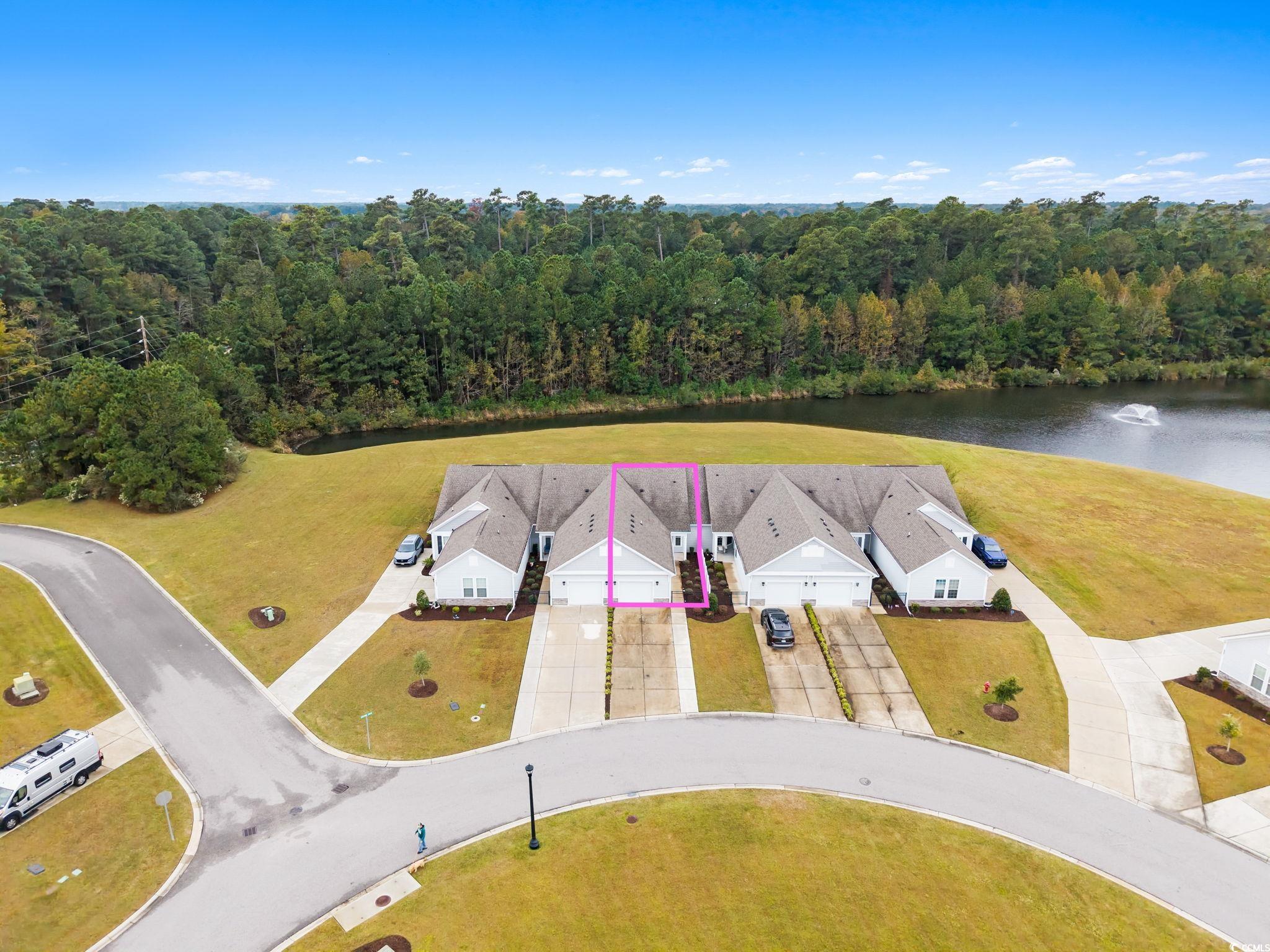 Aerial overview of property's location with a nearby body of water and property parcel outlined