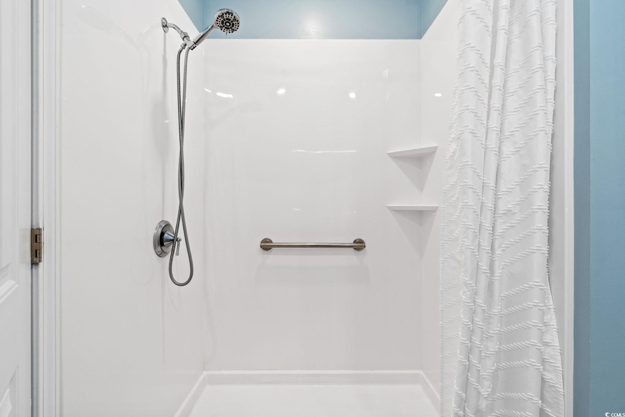 797 Salerno Circle, Unit C Myrtle Beach, SC 29579 - Photo 17 of 40 Bathroom with a shower with shower curtain