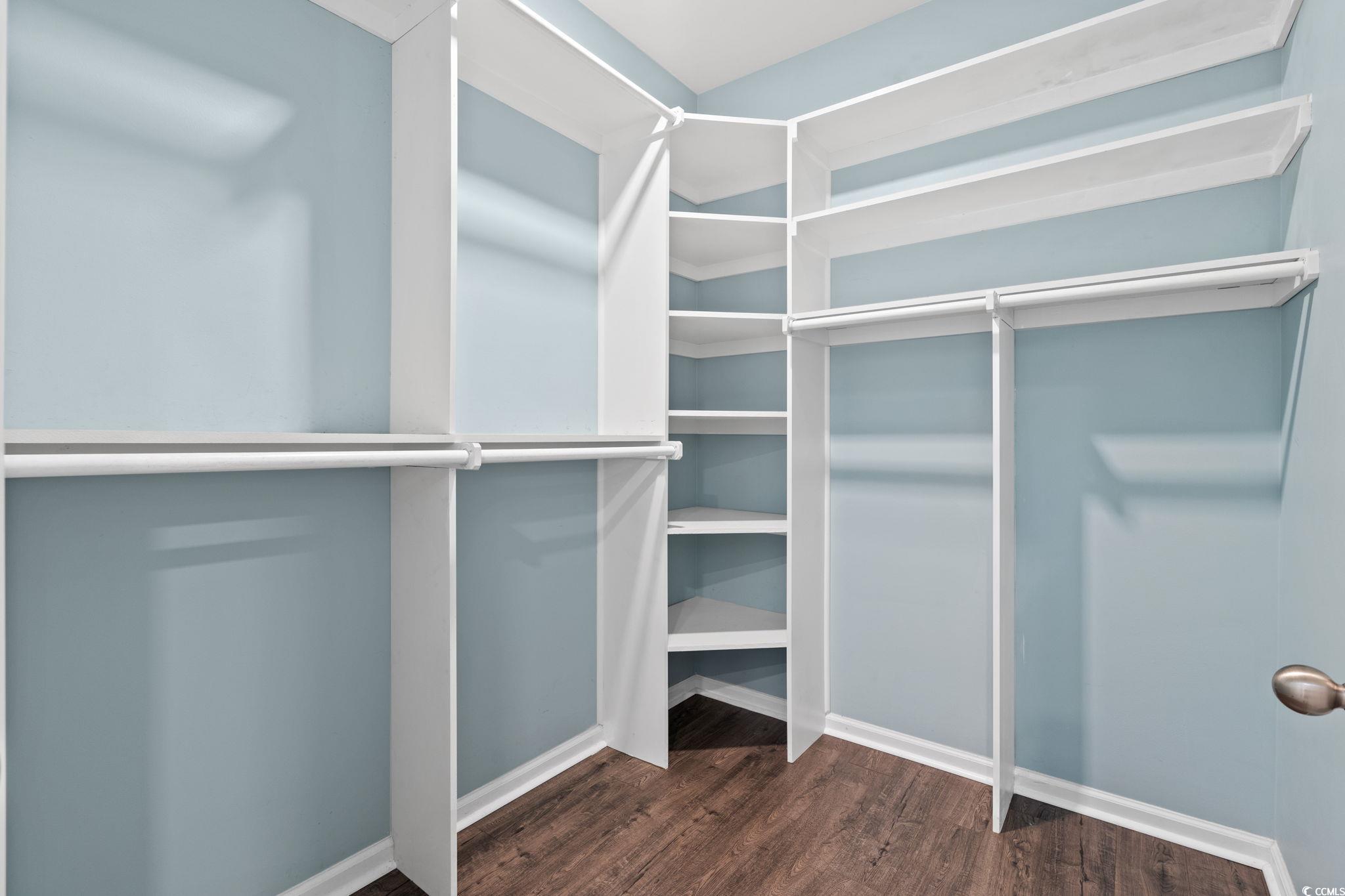 797 Salerno Circle, Unit C Myrtle Beach, SC 29579 - Photo 18 of 40 Walk in closet featuring dark wood-style floors