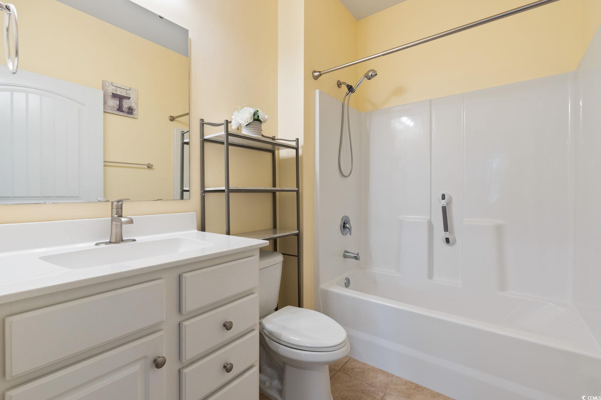 797 Salerno Circle, Unit C Myrtle Beach, SC 29579 - Photo 22 of 40 Bathroom featuring vanity, light tile patterned floors, and shower combination