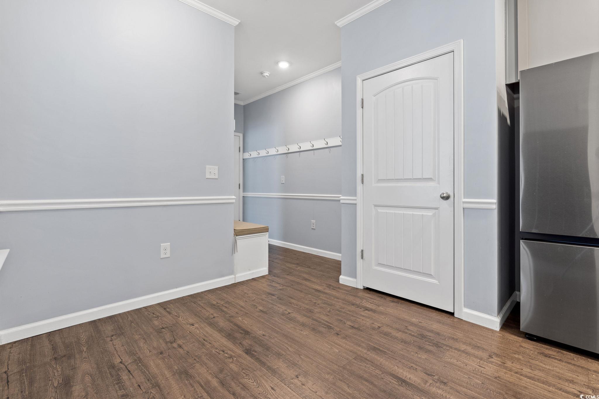 797 Salerno Circle, Unit C Myrtle Beach, SC 29579 - Photo 24 of 40 Empty room with ornamental molding, dark wood-style floors, and recessed lighting