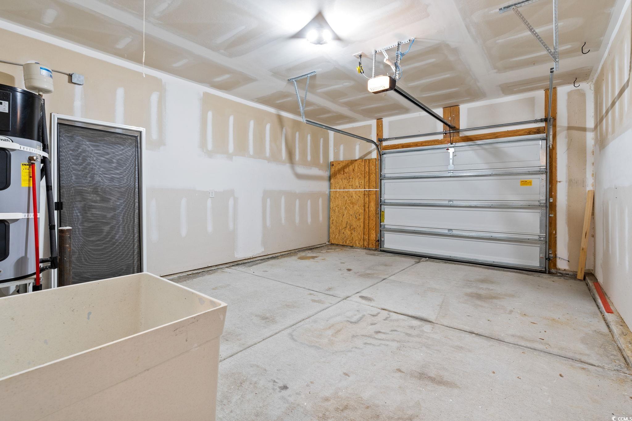 797 Salerno Circle, Unit C Myrtle Beach, SC 29579 - Photo 29 of 40 Garage with a garage door opener and water heater
