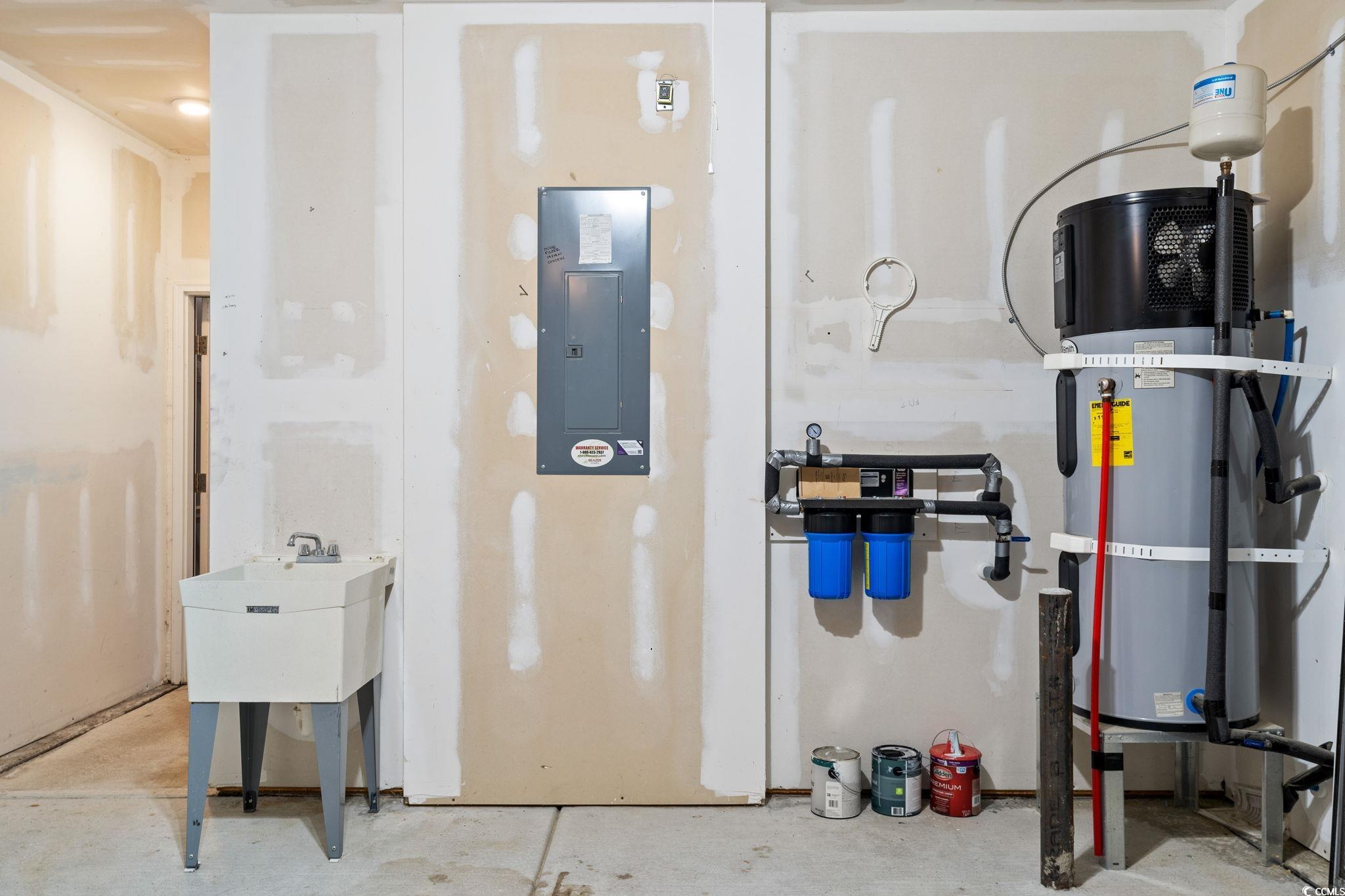 797 Salerno Circle, Unit C Myrtle Beach, SC 29579 - Photo 30 of 40 Utility room featuring electric panel and heat pump water heater