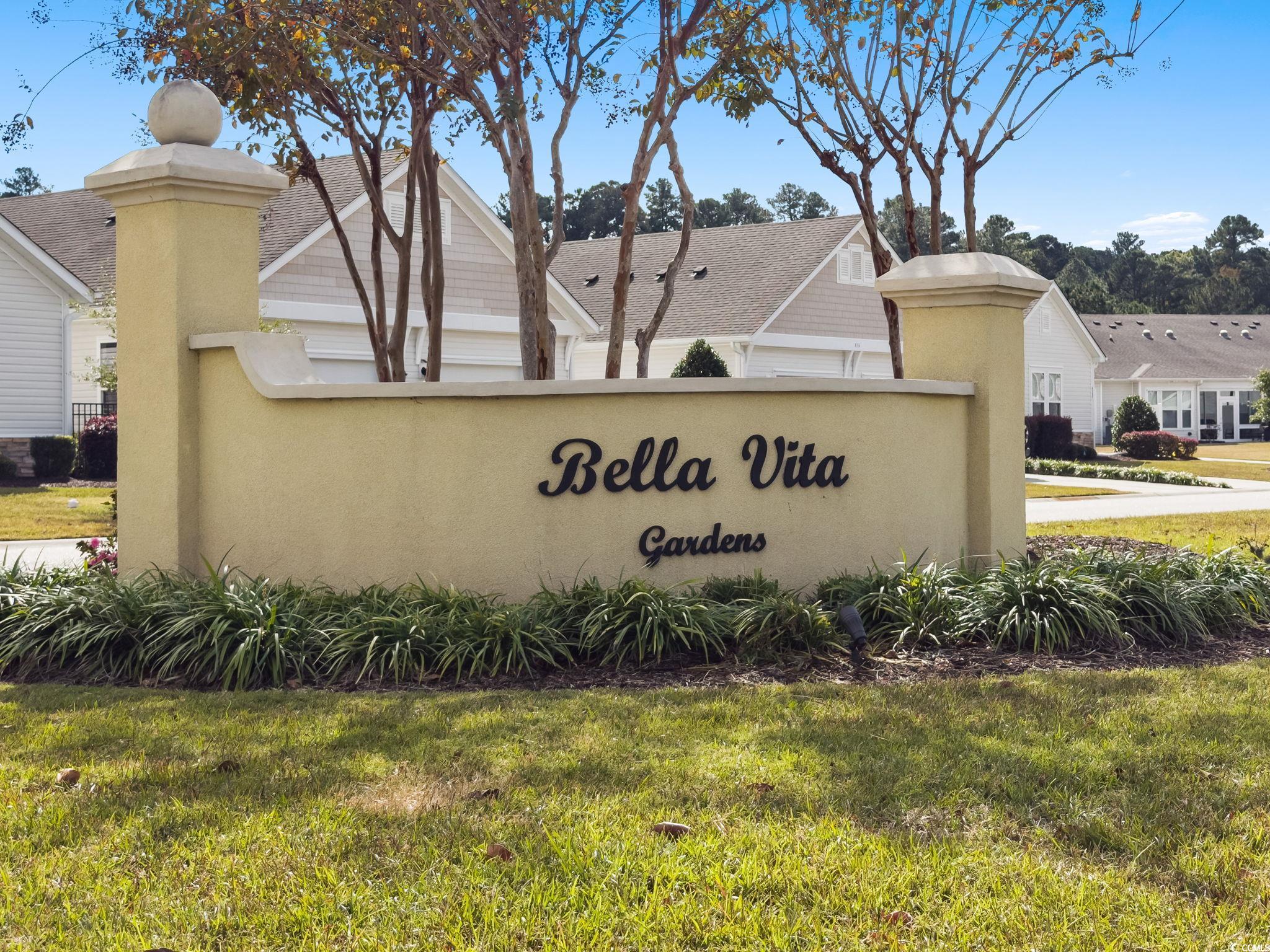 797 Salerno Circle, Unit C Myrtle Beach, SC 29579 - Photo 31 of 40 Community sign with a yard and a residential view