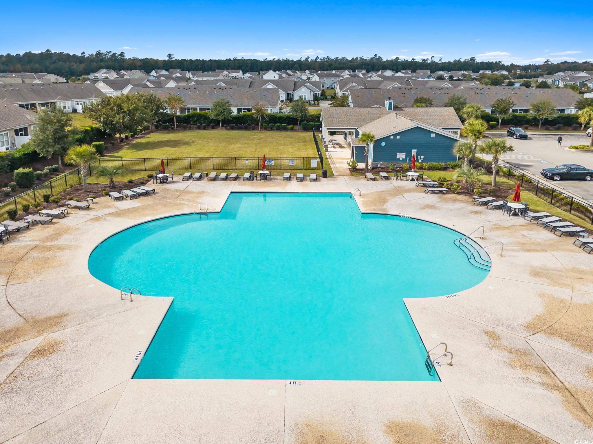 797 Salerno Circle, Unit C Myrtle Beach, SC 29579 - Photo 34 of 40 Community pool featuring a residential view and a patio
