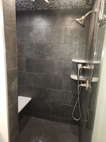 a kitchen with white cabinets and appliances