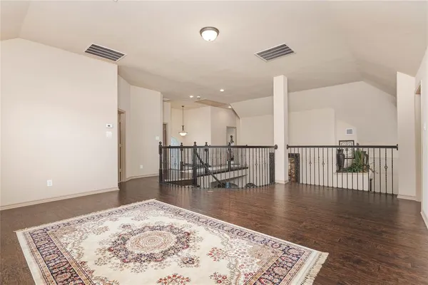 a living room with lots of chairs and a table