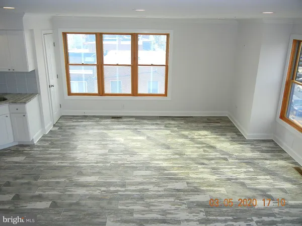 a view of an empty room and window