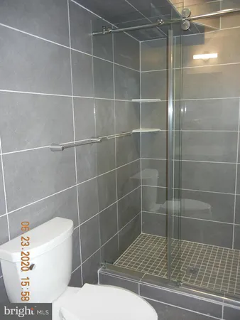 a bathroom with a sink toilet and a mirror