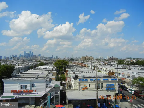 a front view of building with cars parked
