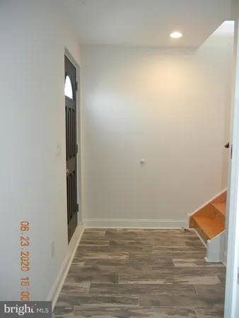 a kitchen with stainless steel appliances a refrigerator and a stove top oven