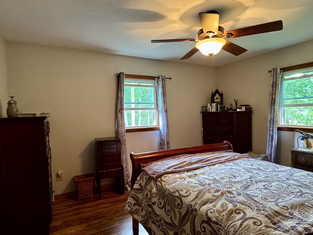 171 Haydenville Road Whately, MA 01093 - Photo 14 of 24 a bedroom with a bed and a chandelier