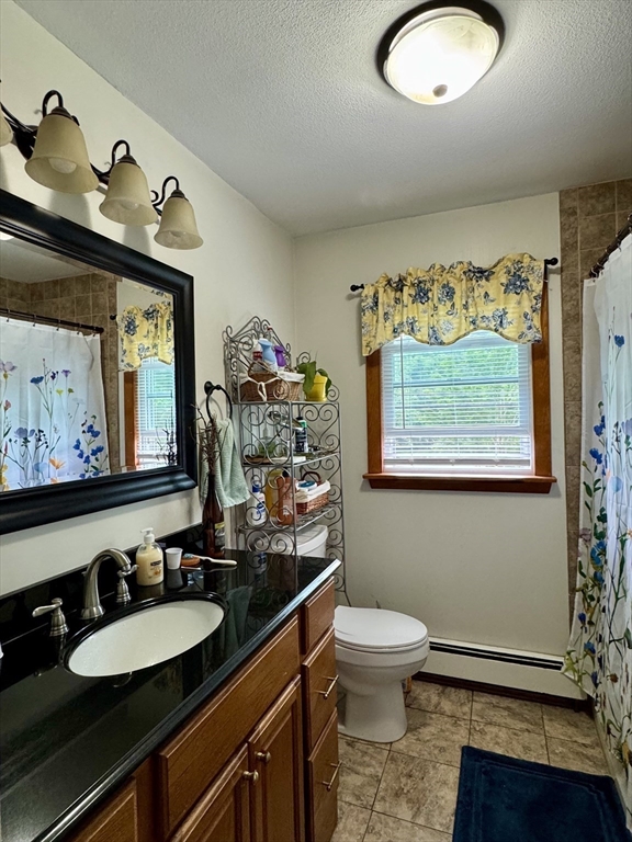 171 Haydenville Road Whately, MA 01093 - Photo 18 of 24 a bathroom with a toilet a sink and a mirror