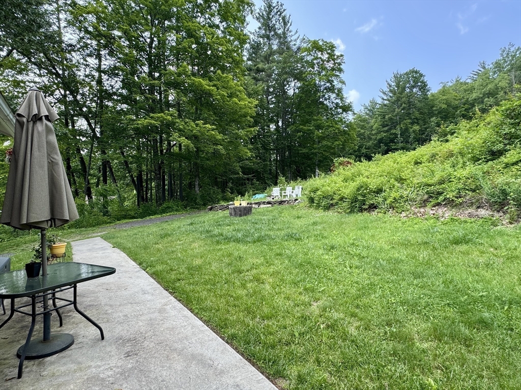 171 Haydenville Road Whately, MA 01093 - Photo 5 of 24 a view of backyard with a table and chairs
