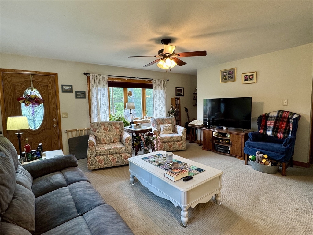 171 Haydenville Road Whately, MA 01093 - Photo 8 of 24 a living room with furniture a flat screen tv and a window
