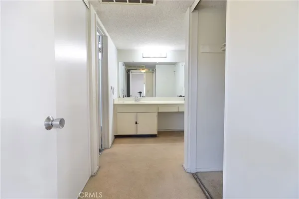 a bathroom with a sink a mirror and a bathtub