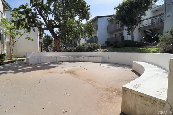 a view of backyard with large trees