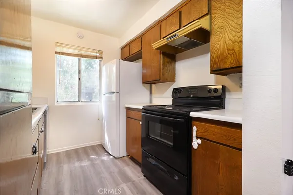 a kitchen with a stove and a microwave