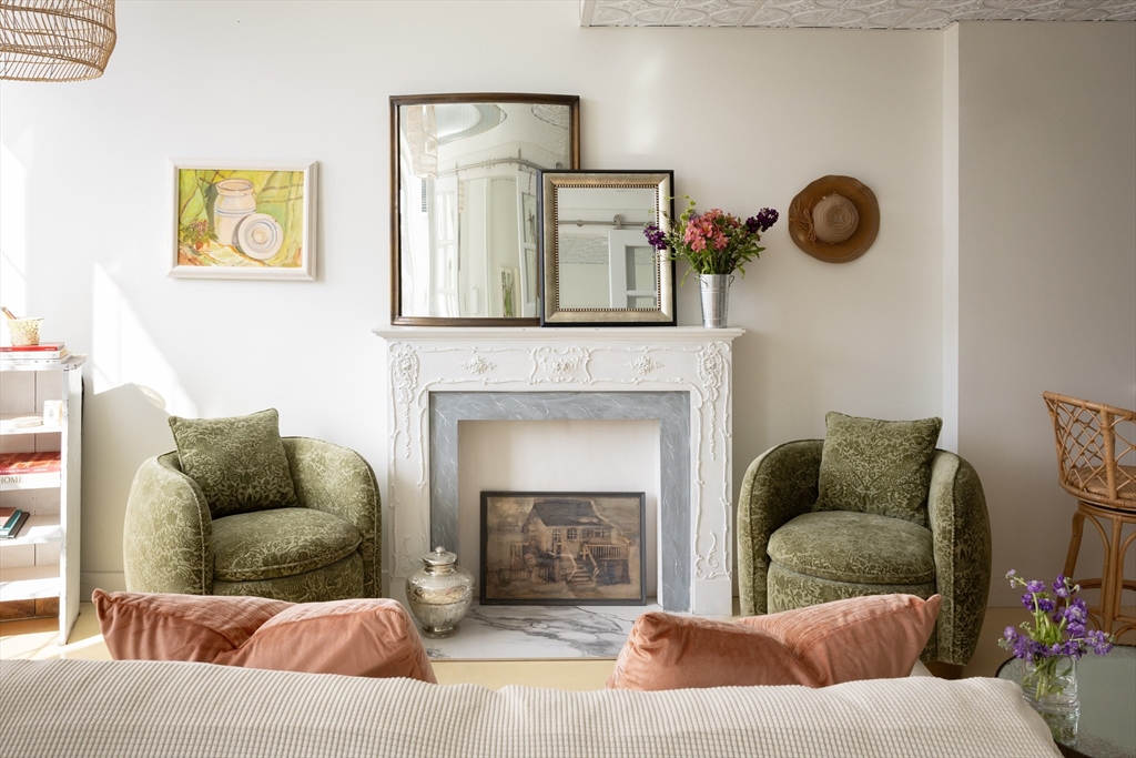 200 Market Street, Unit 4504 Lowell, MA 01852 - Photo 1 of 19 a living room with furniture and a fireplace