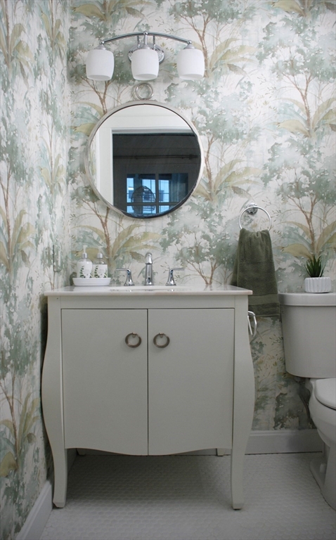 200 Market Street, Unit 4504 Lowell, MA 01852 - Photo 11 of 19 a bathroom with a toilet and a sink