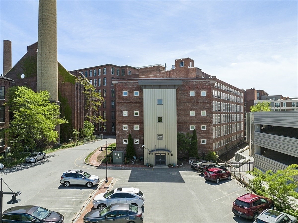 200 Market Street, Unit 4504 Lowell, MA 01852 - Photo 14 of 19 a car parked in front of a building