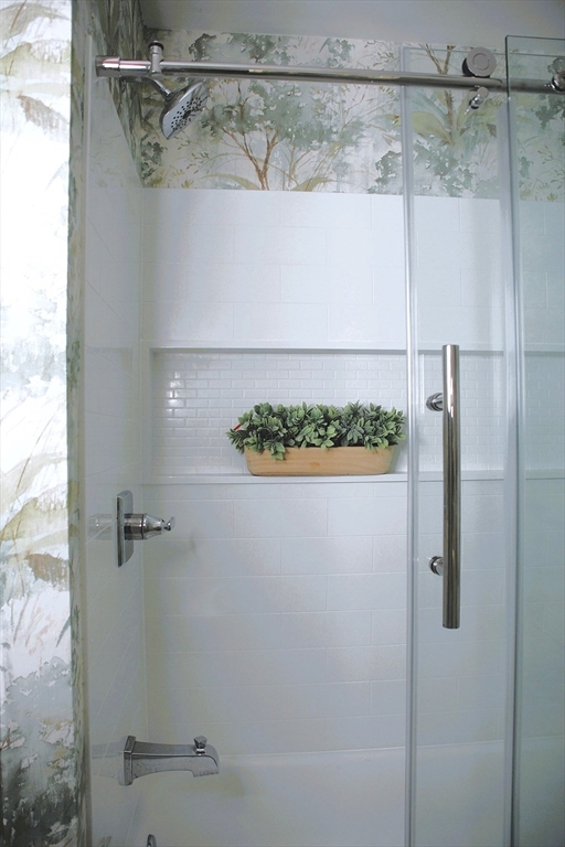 200 Market Street, Unit 4504 Lowell, MA 01852 - Photo 8 of 19 a bathroom with a shower