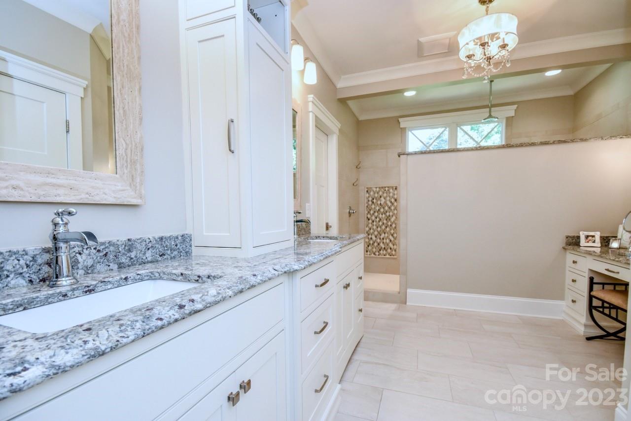 645 Kemp Road Mooresville, NC 28117 - Photo 18 of 48 a bathroom with a sink and a mirror