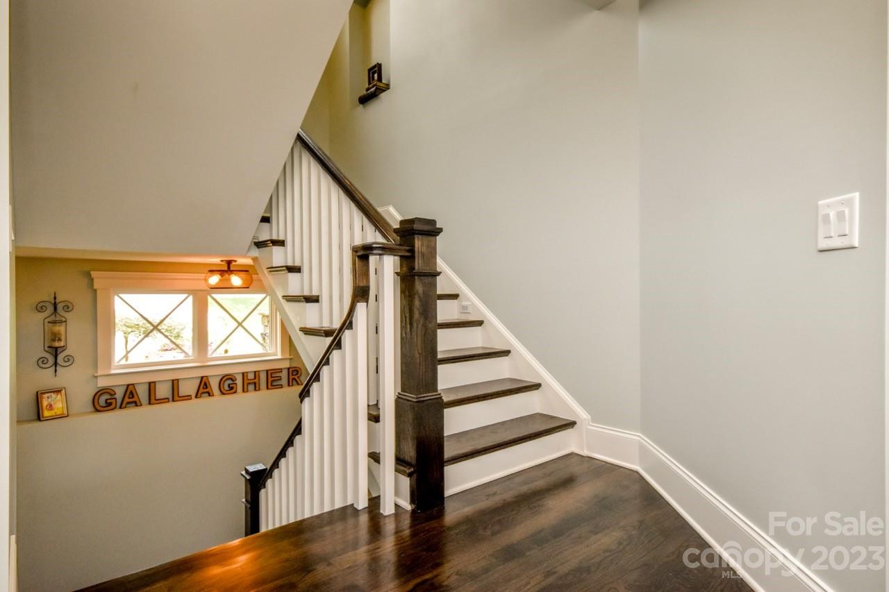 645 Kemp Road Mooresville, NC 28117 - Photo 20 of 48 a view of entryway with wooden floor and stairs