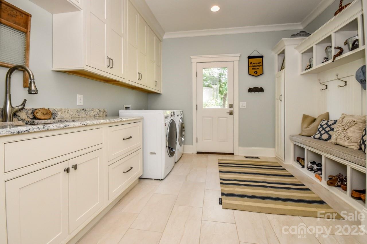 645 Kemp Road Mooresville, NC 28117 - Photo 21 of 48 a kitchen with stainless steel appliances cabinets and a window