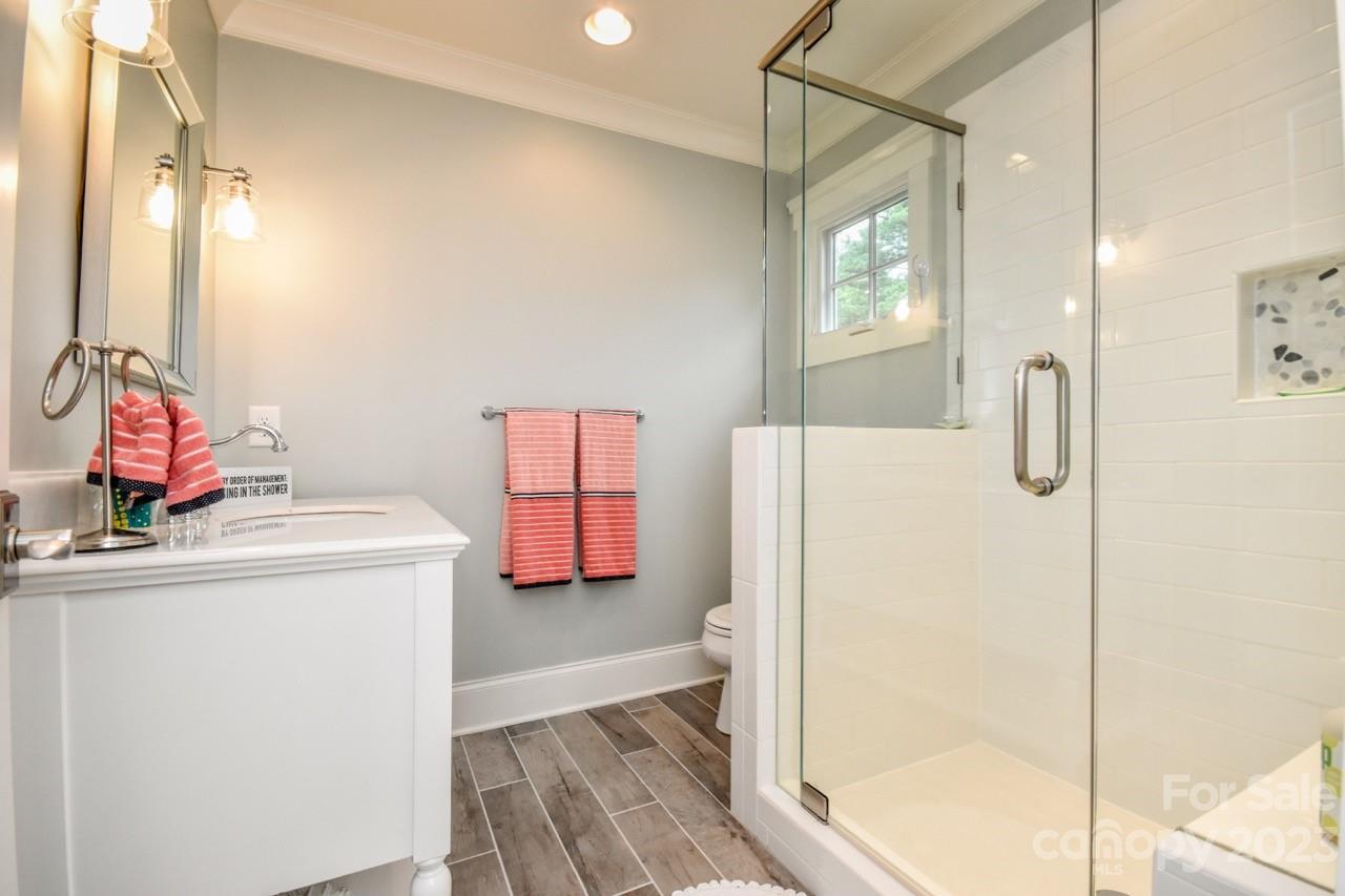 645 Kemp Road Mooresville, NC 28117 - Photo 26 of 48 a bathroom with a tub shower vanity and a sink