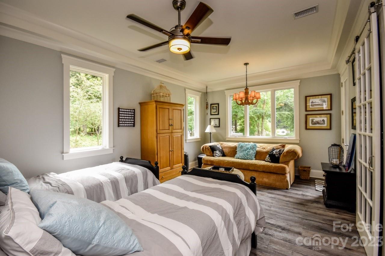 645 Kemp Road Mooresville, NC 28117 - Photo 28 of 48 a bedroom with two beds and a large window