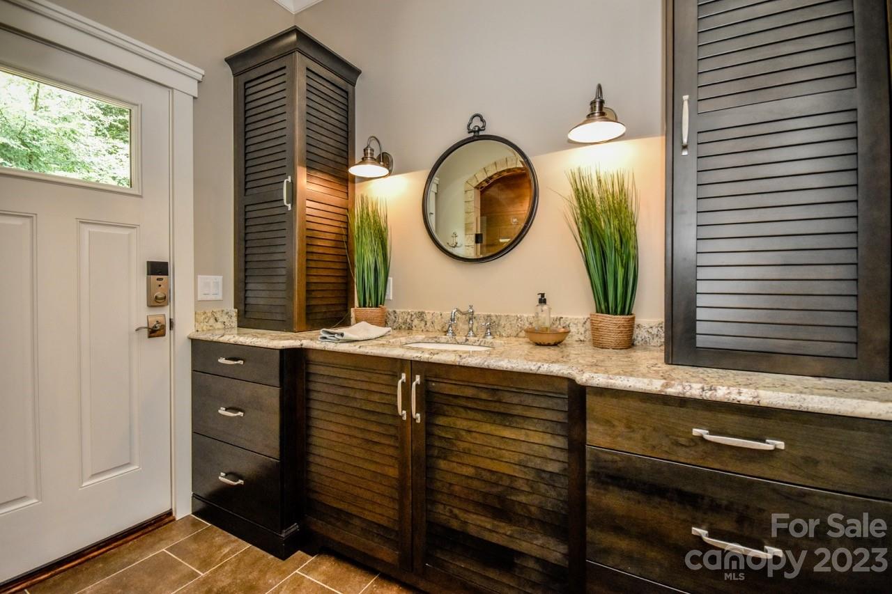 645 Kemp Road Mooresville, NC 28117 - Photo 29 of 48 a bathroom with a sink and a mirror