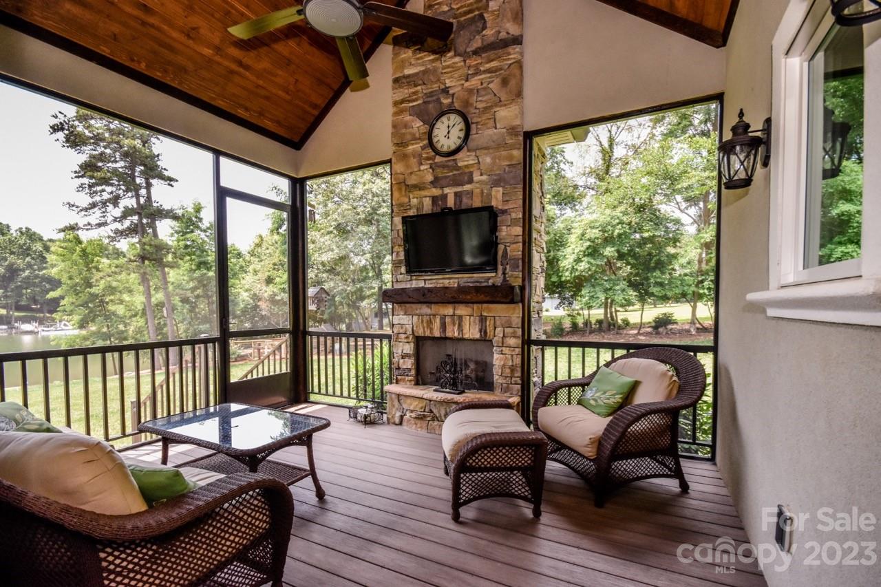 645 Kemp Road Mooresville, NC 28117 - Photo 40 of 48 a view of a porch with furniture and a fireplace