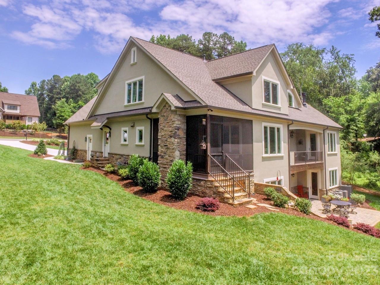 645 Kemp Road Mooresville, NC 28117 - Photo 4 of 48 a view of a house with a big yard plants and large trees