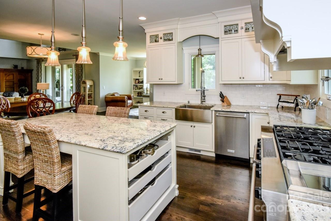 645 Kemp Road Mooresville, NC 28117 - Photo 7 of 48 a kitchen with a sink stove and cabinets