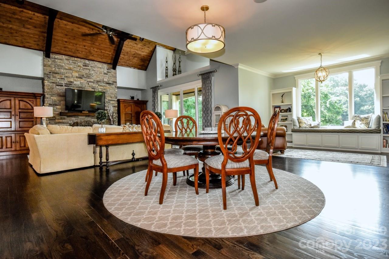 645 Kemp Road Mooresville, NC 28117 - Photo 10 of 48 a dining room with furniture a large window and wooden floor