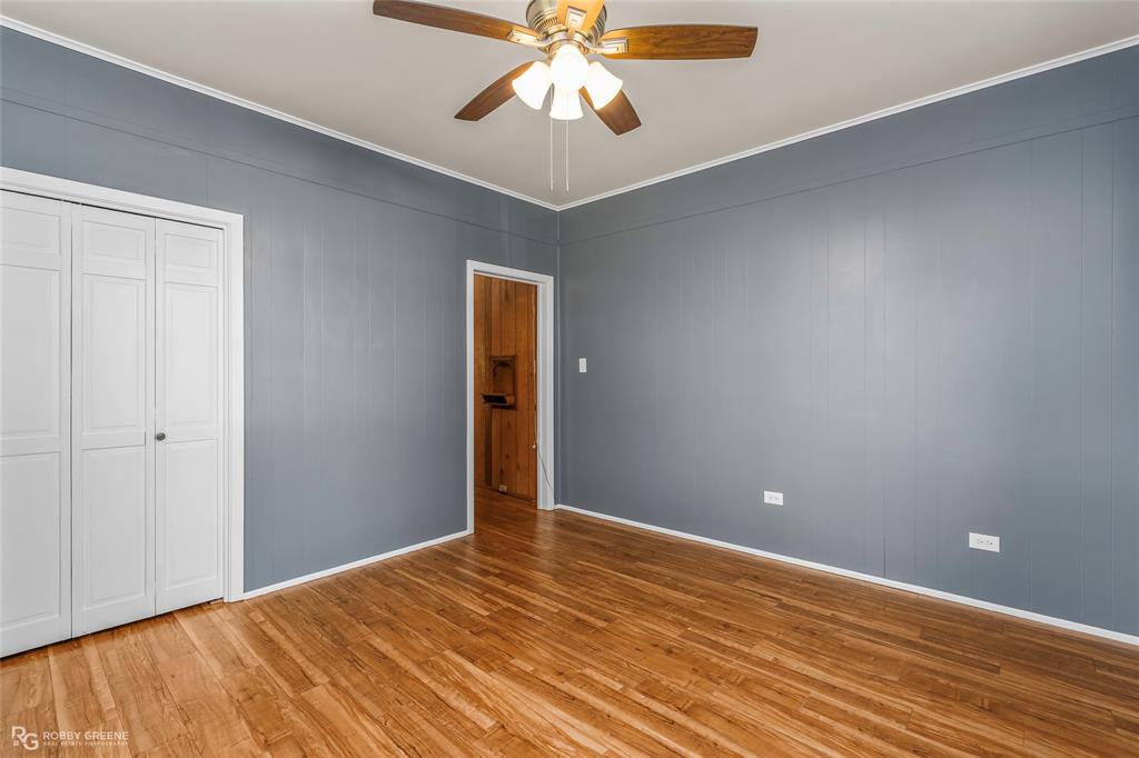 104 3rd Street Northwest Springhill, LA 71075 - Photo 23 of 28 a view of an empty room with window and wooden floor
