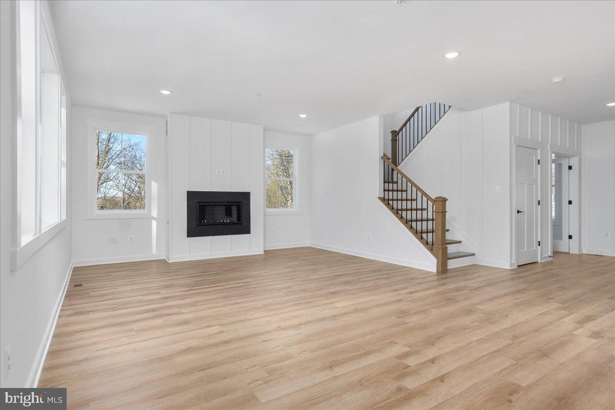 13935 Harrisville Road Mount Airy, MD 21771 - Photo 34 of 73 a view of an empty room with wooden floor and a window