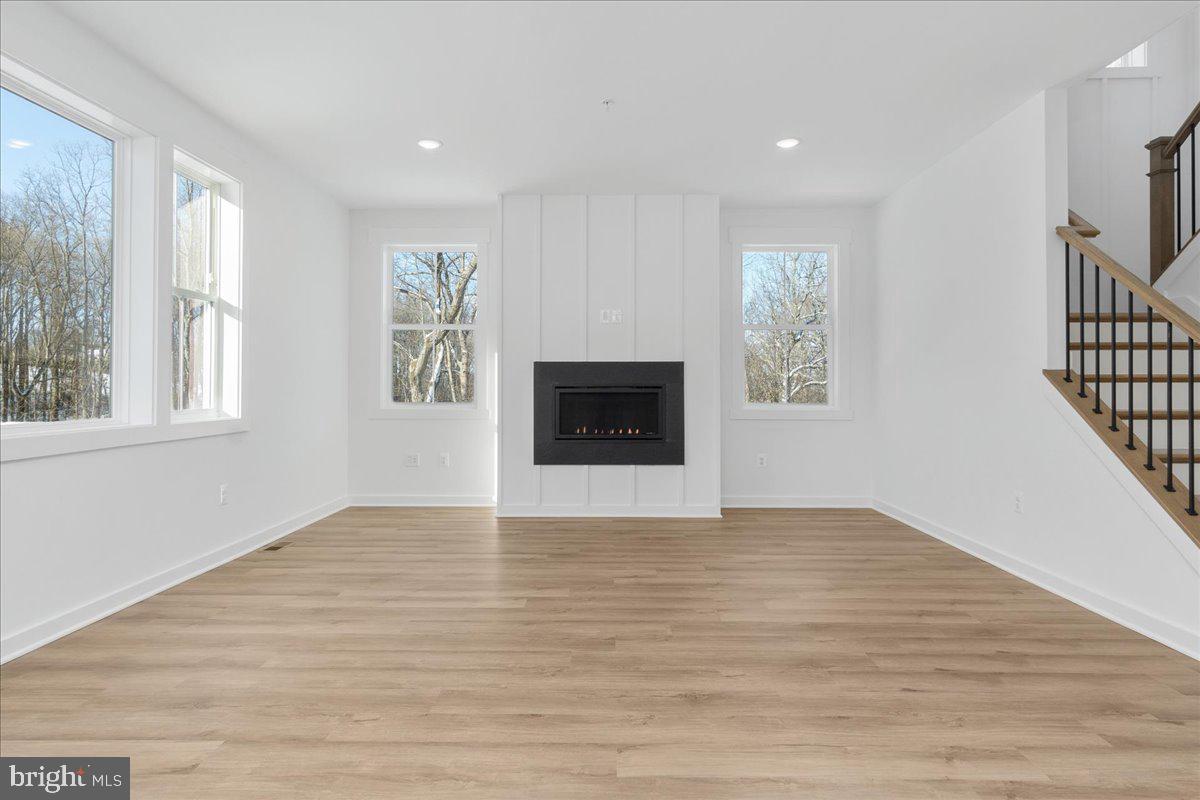13935 Harrisville Road Mount Airy, MD 21771 - Photo 35 of 73 a view of an empty room with wooden floor and a window