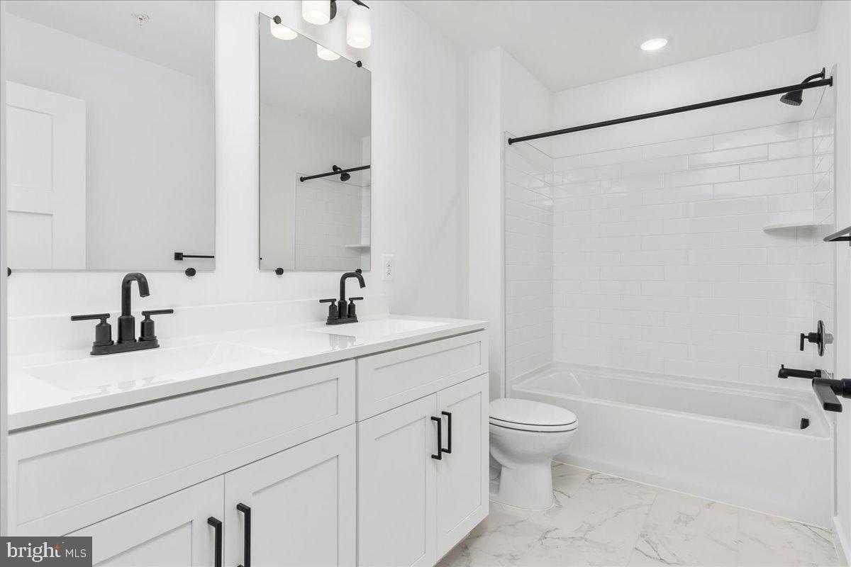13935 Harrisville Road Mount Airy, MD 21771 - Photo 51 of 73 a bathroom with a sink a toilet and a large mirror