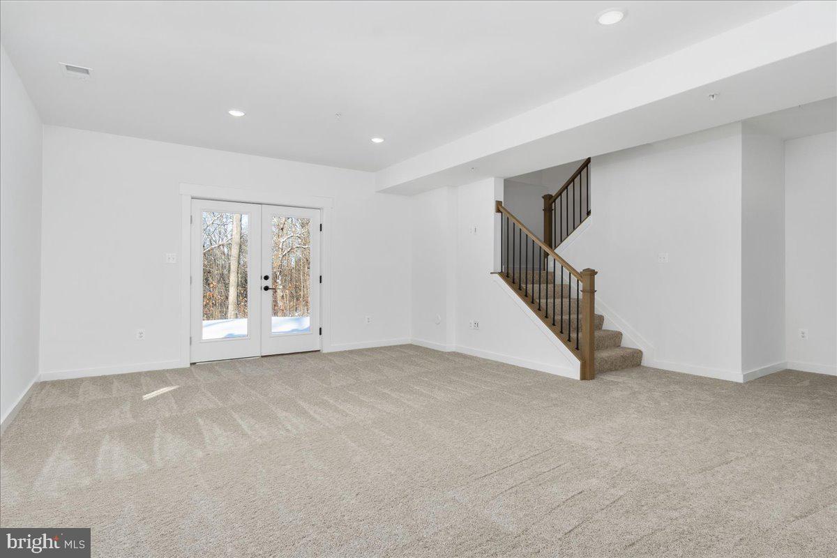 13935 Harrisville Road Mount Airy, MD 21771 - Photo 53 of 73 a view of an empty room with wooden floor and stairs