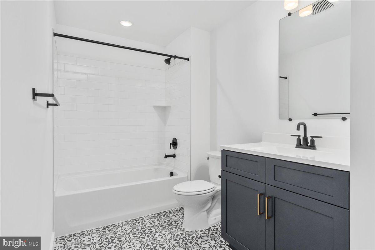 13935 Harrisville Road Mount Airy, MD 21771 - Photo 56 of 73 a bathroom with a sink a toilet and a bathtub