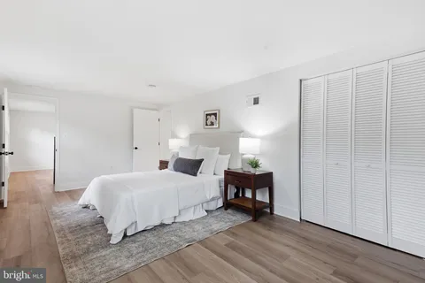 a bedroom with a bed and a table