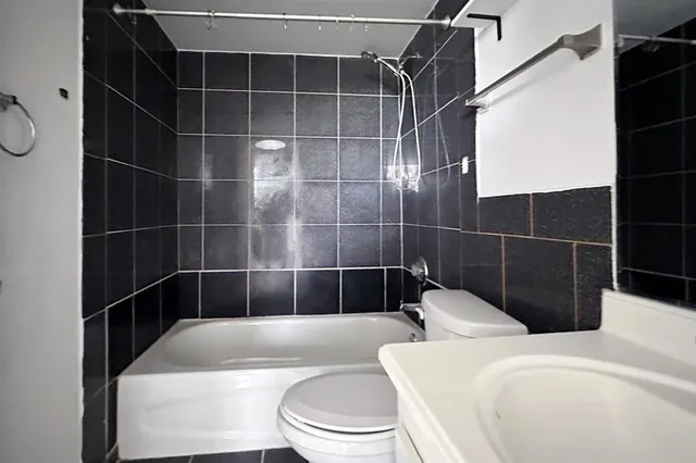 a front view of a building with a yard