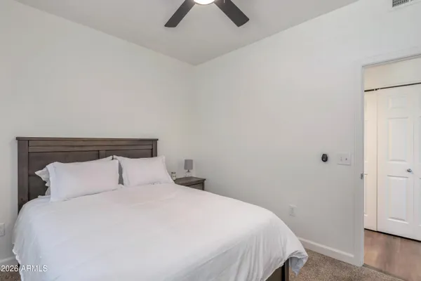 a bedroom with a bed and closet