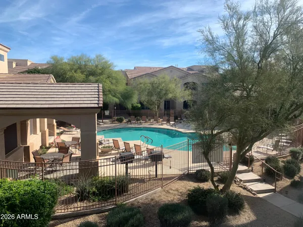 a view of a chairs and table in the patio