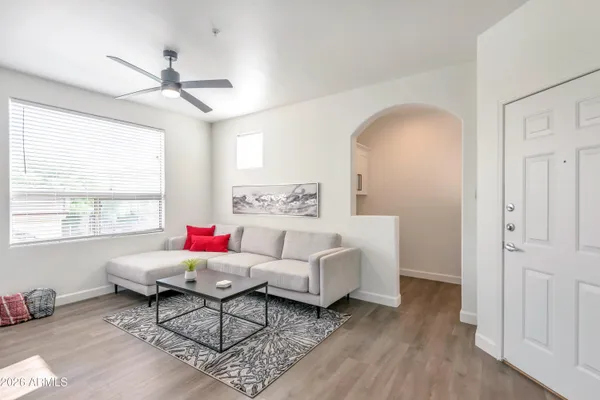 a living room with furniture and a window