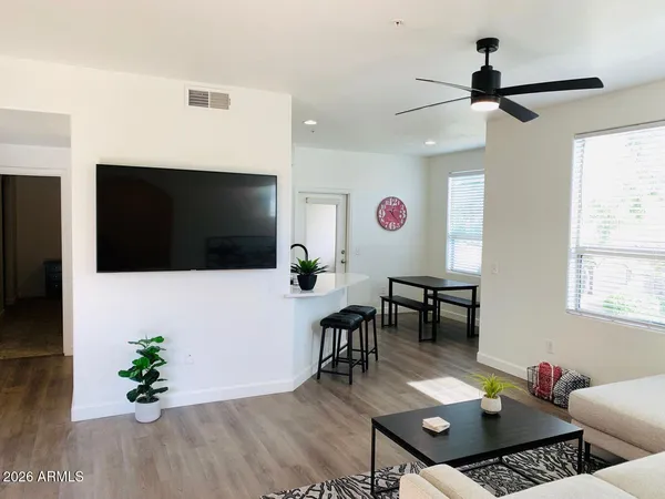a living room with furniture and a flat screen tv