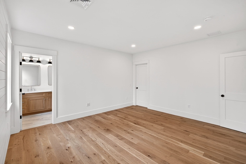 132 Great Western Road Harwich, MA 02645 - Photo 25 of 42 wooden floor in an empty room with a window